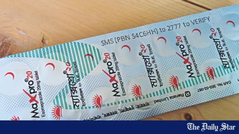 A blister strip printed with an SMS short-code and the instruction to text it to verify the pack.